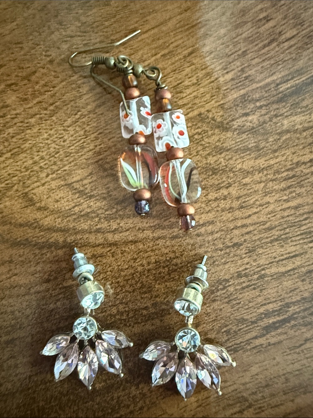 Two pairs of red and pink earrings